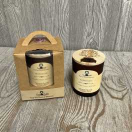 Brown glass scented candle with wooden lid and matching candle packaged in a kraft gift box