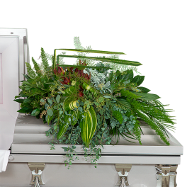 Large green floral spray on a silver casket