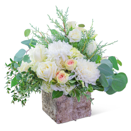 White roses and chrysanthemums in a rustic square container