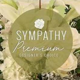 White floral arrangement with a sympathy premium label