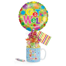 Get Well balloon above a gift mug with candy and ribbon