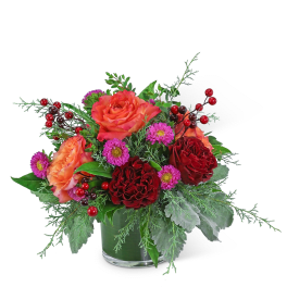 Bouquet of red and orange roses with purple daisies in a glass vase