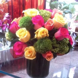 Bouquet of multicolored roses in a black vase