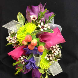 Colorful bouquet with pink roses, purple blooms, and lime-green flowers