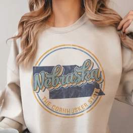 Woman wearing a Nebraska graphic sweatshirt