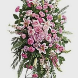 Tall pink floral standing spray on an easel