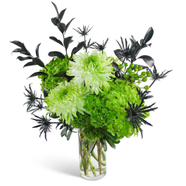 Green and white chrysanthemum arrangement in a clear glass vase