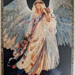 Tapestry of an angel in a flowing dress holding flowers