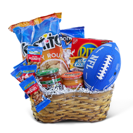 Basket of snack foods with chips, peanuts, salsa, and a toy football