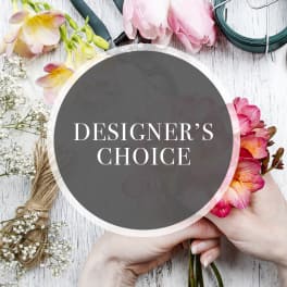 Designer’s choice floral arrangement with pink and yellow blooms