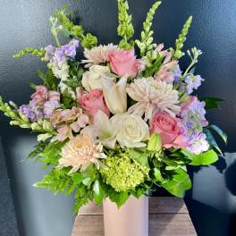 Pink and white mixed bouquet in a tall blush vase