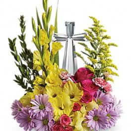 Mixed bouquet with yellow gladiolus, pink roses, and lavender daisies around a silver ribbon