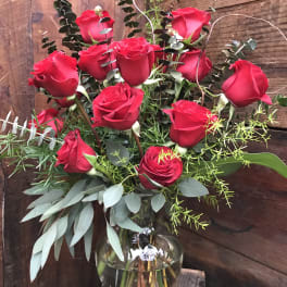Bouquet of red roses in a clear glass vase