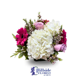 Bouquet of white hydrangea, pink gerberas, and lavender roses
