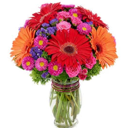 Colorful mixed bouquet in a clear glass vase