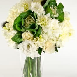 White floral bouquet in a clear glass vase