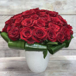 Red rose bouquet in a white vase