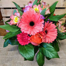 Pink gerbera daisy bouquet with an orange rose and mixed blooms