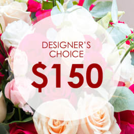 Mixed roses in pink, white, and peach with a $150 designer's choice label
