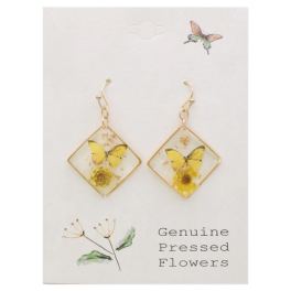 Pair of gold-tone earrings with yellow butterfly and flower inserts on a card