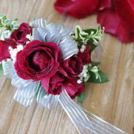 Small bouquet of red roses with a silver ribbon