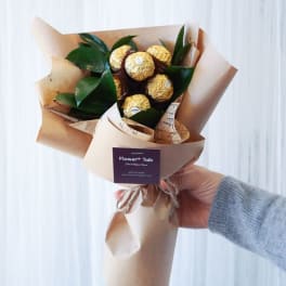 Bouquet of Ferrero Rocher chocolates wrapped in brown paper