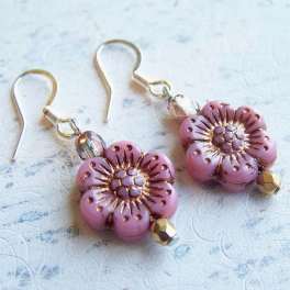 Pair of pink flower-shaped beaded earrings with gold hooks