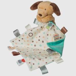 Plush dog attached to a patterned baby blanket with ribbon tags