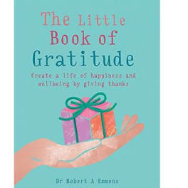 Small teal book titled 'The Little Book of Gratitude' with an illustration of a hand holding a wrapped gift.