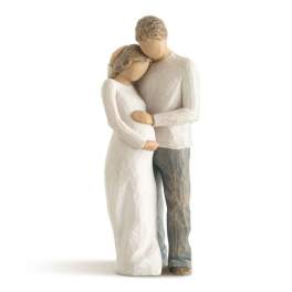 Wooden figurine of a couple embracing