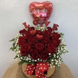 Red rose arrangement with a heart balloon and LOVE picks