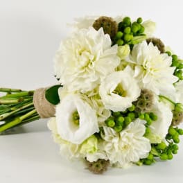White bouquet with green berries and wrapped stems