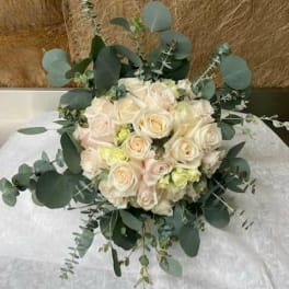 Bouquet of cream roses with eucalyptus greenery