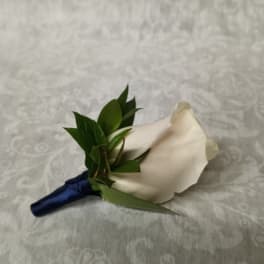 White rose boutonniere with dark blue ribbon wrap