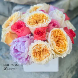 Bouquet of multicolored roses in a white box