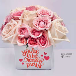 Pink and cream roses in a white box with a heart message