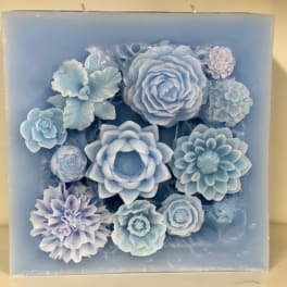 Blue floral candle with layered flower shapes