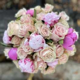 Bouquet of pale pink roses and pink peonies