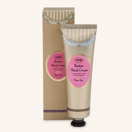 Two tubes of rose tea hand cream in beige packaging