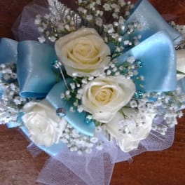 White roses with blue ribbon and baby's breath bouquet