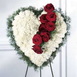 Heart-shaped floral standing spray with red roses and white flowers