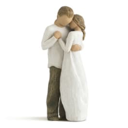 Wooden figurine of a couple embracing
