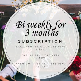 Subscription sign over a floral arrangement with daisies and roses