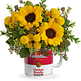 Sunflower bouquet arranged in a Campbell's soup mug