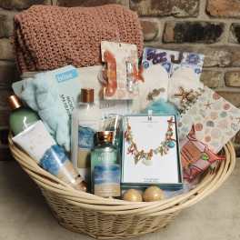 Gift basket with bath products, jewelry, and accessories
