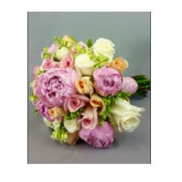 Bouquet of pink, white, and peach roses with lavender blooms