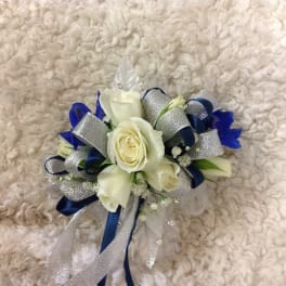 White rose corsage with blue and silver ribbon accents