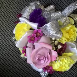 Small bouquet with pink and yellow flowers and silver ribbon
