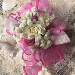 White rose bouquet with bright pink ribbon and lace wrap