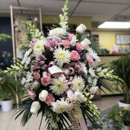 Large pink and white floral spray with ribbon and card